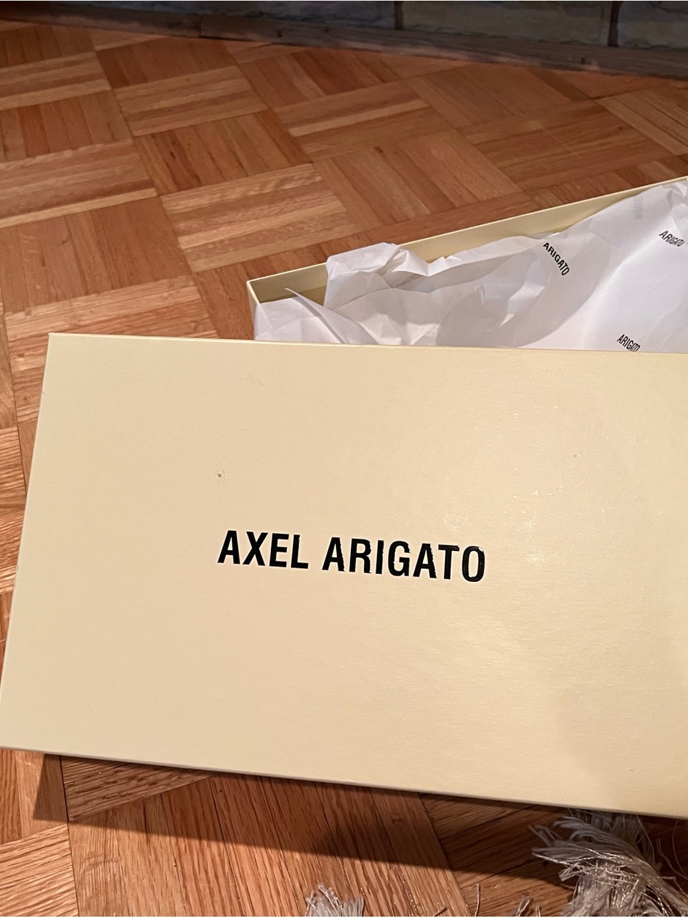 Axel Arigato Cream and Black Logo Shoe Box